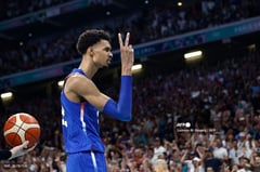 France pips Japan, makes Paris quarters